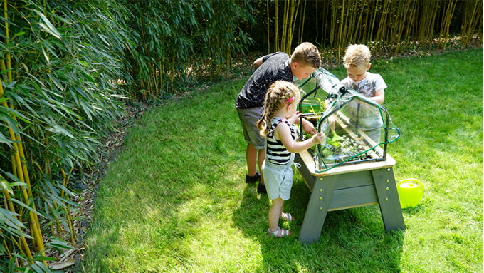 Playing outside in a small garden with EXIT Toys